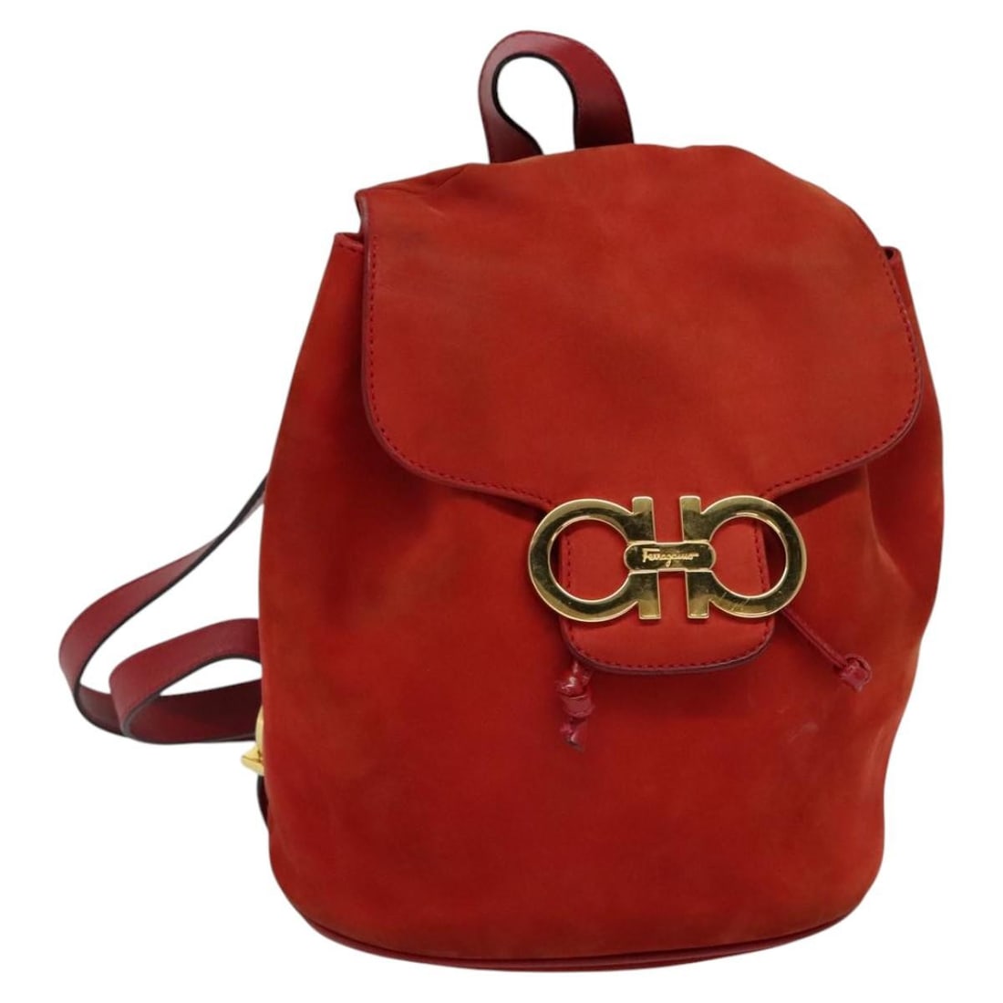 Red Suede Salvatore Ferragamo Women's Backpack Made in Italy: Red Suede Salvatore Ferragamo Women's Backpack Made in Italy This Salvatore Ferragamo women's backpack is crafted from red suede and features a compact design. The bag shows signs of heavy use, includ