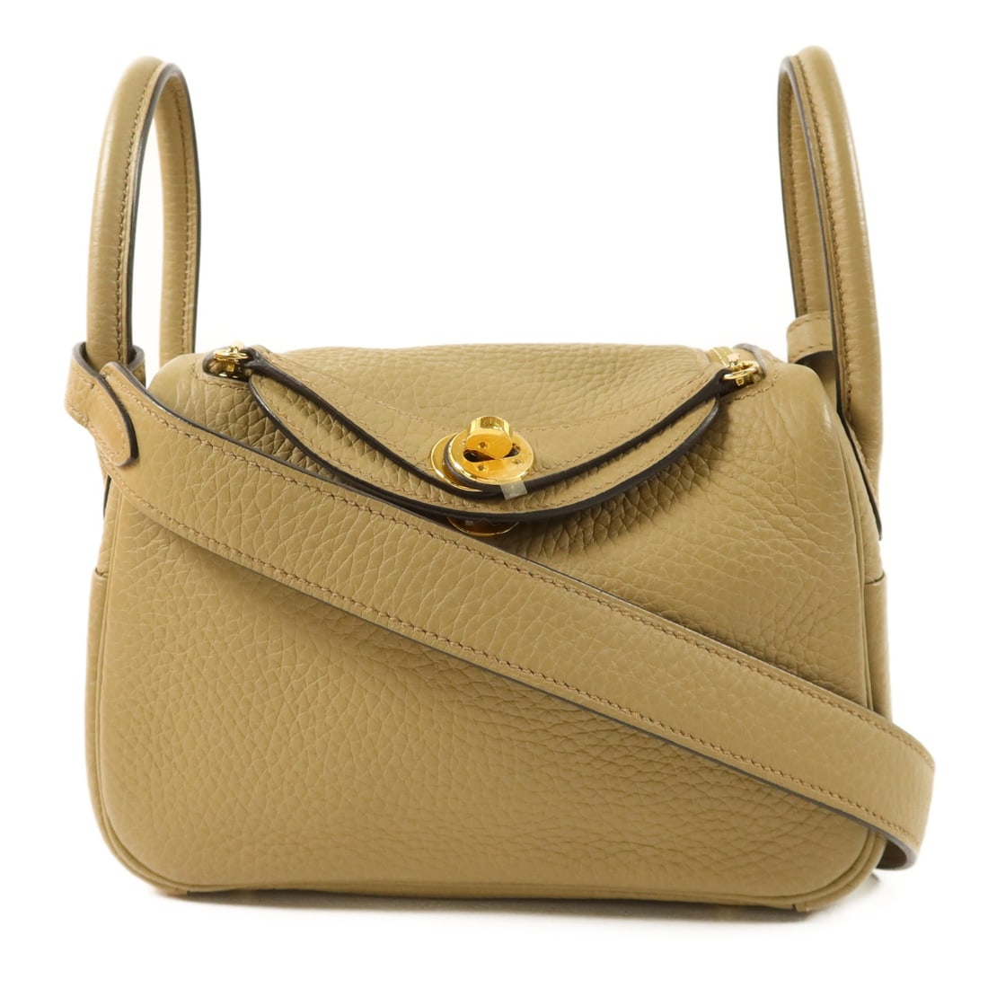 Mini Lindy Beige Clemence Leather Shoulder Bag with Gold Hardware by Hermes: Mini Lindy Beige Clemence Leather Shoulder Bag with Gold Hardware by Hermes This Hermes Mini Lindy 2-way shoulder bag is crafted from Clemence calfskin leather in a beige color. Designed for women, it