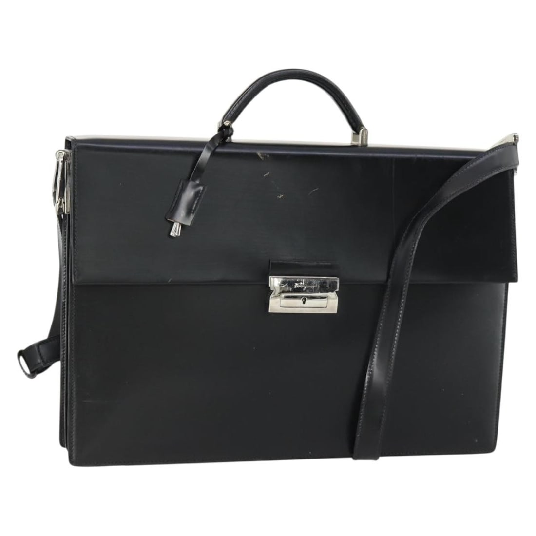 Black Leather Business Bag by Salvatore Ferragamo with Two Carrying Options: Black Leather Business Bag by Salvatore Ferragamo with Two Carrying Options This Salvatore Ferragamo business bag is crafted from black leather and made in Italy. Designed for versatility, it features