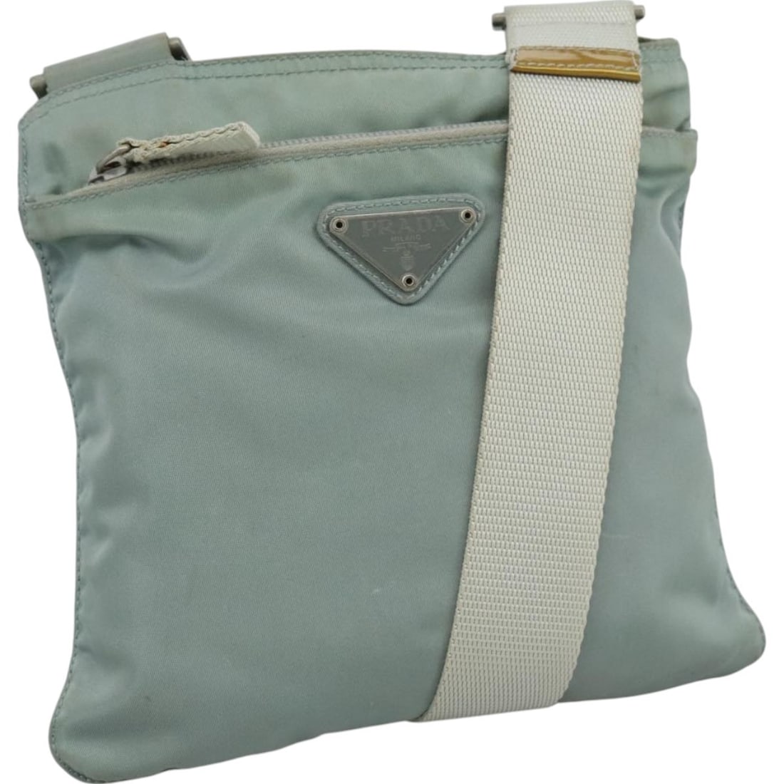 Prada nylon light blue shoulder bag women Italy: Prada nylon light blue shoulder bag women Italy This PRADA shoulder bag is crafted from light blue nylon and is designed for women. Made in Italy, the bag features a compact silhouette with approximat