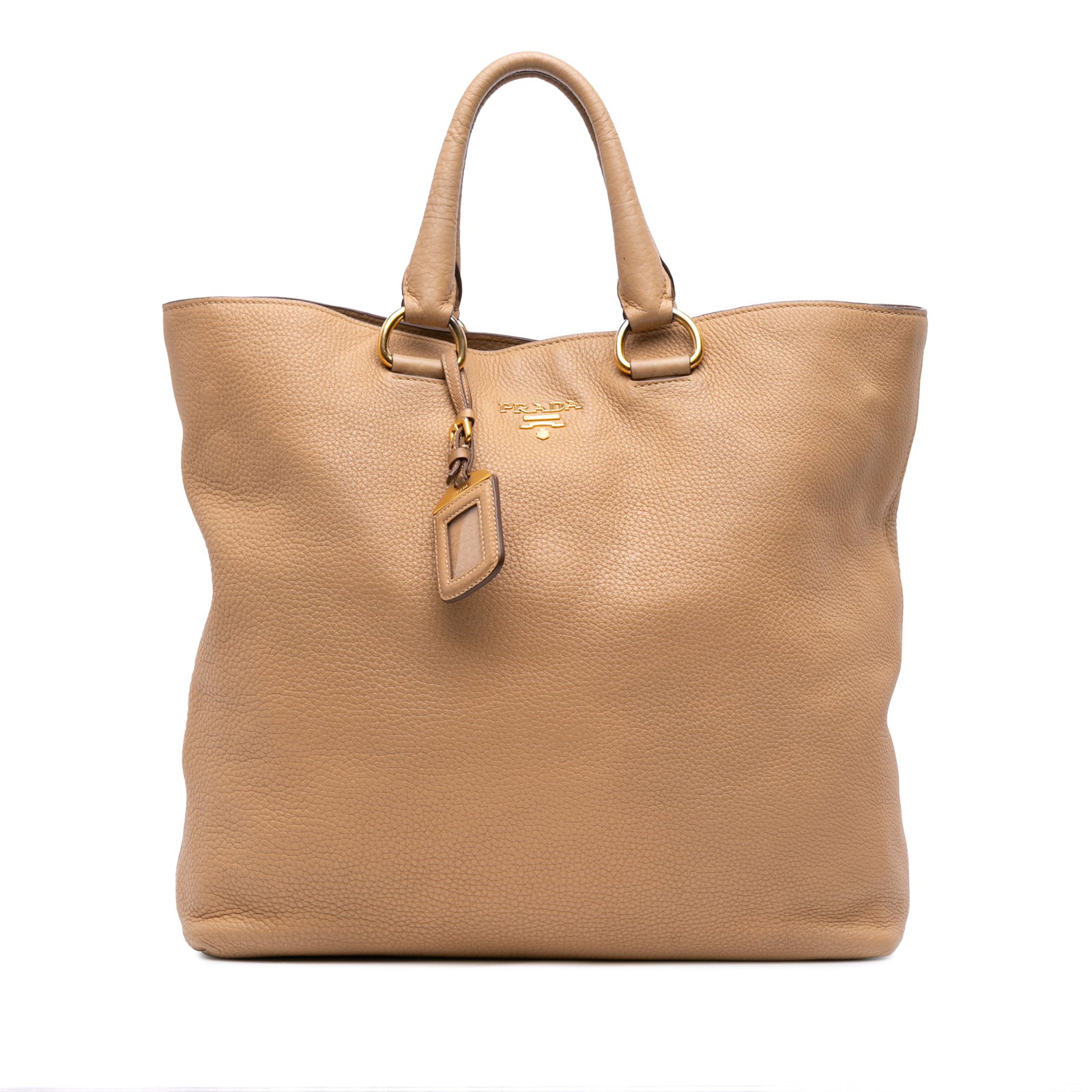 Prada Vitello Daino Convertible Tote Brown Leather Bag: Prada Vitello Daino Convertible Tote Brown Leather Bag Introducing the Prada Vitello Daino Open Convertible Tote, a stylish and functional accessory crafted from premium vitello daino leather. This to