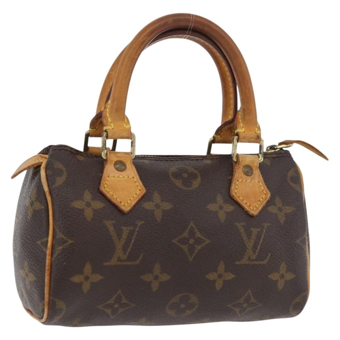 Louis Vuitton Mini Speedy Monogram Canvas Handbag M41534: Louis Vuitton Mini Speedy Monogram Canvas Handbag M41534 This Louis Vuitton Monogram Mini Speedy Hand Bag is crafted from the brand's signature monogram canvas and features a compact silhouette. The b