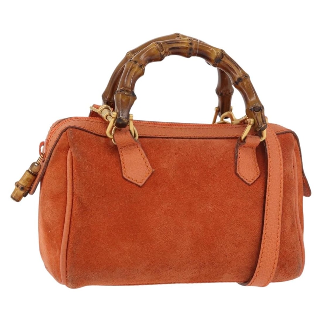 Gucci Bamboo suede orange gold mini handbag with shoulder strap: Gucci Bamboo suede orange gold mini handbag with shoulder strap This GUCCI Bamboo Mini Hand Bag features a two-way design, crafted from orange and gold suede. The bag includes both a top handle and a 