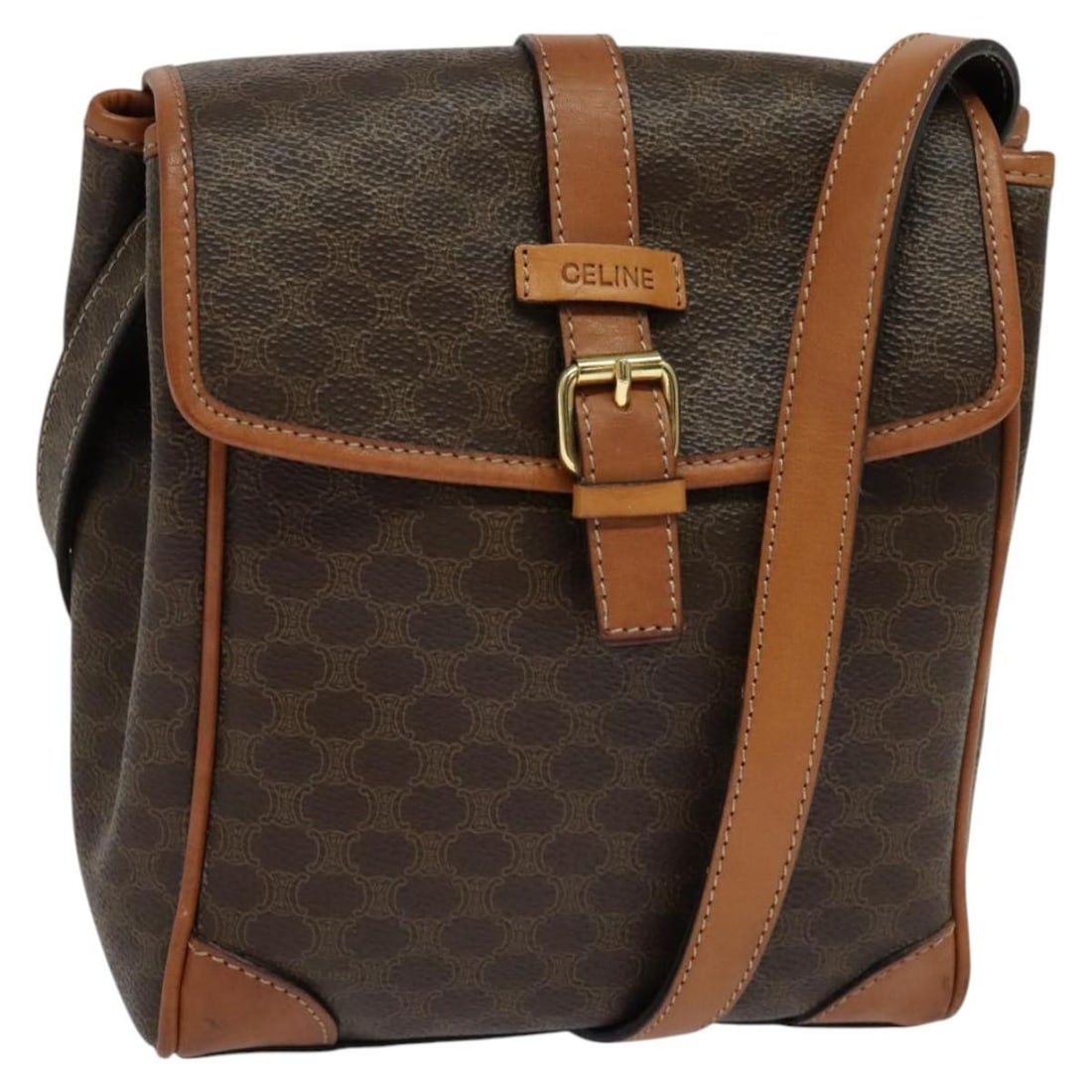 Celine Macadam Brown PVC Canvas Shoulder Bag Gold Tone Accent: Celine Macadam Brown PVC Canvas Shoulder Bag Gold Tone Accent This CELINE Macadam shoulder bag features a brown and gold PVC leather exterior with the signature Macadam canvas design. Designed for wom