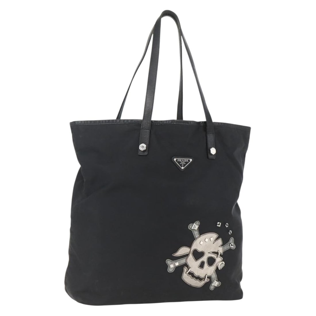 Prada black nylon tote bag silver trim Italy: Prada black nylon tote bag silver trim Italy This PRADA tote bag is crafted from durable black nylon with silver-tone accents. Designed for women, it features a spacious interior and practical handle 