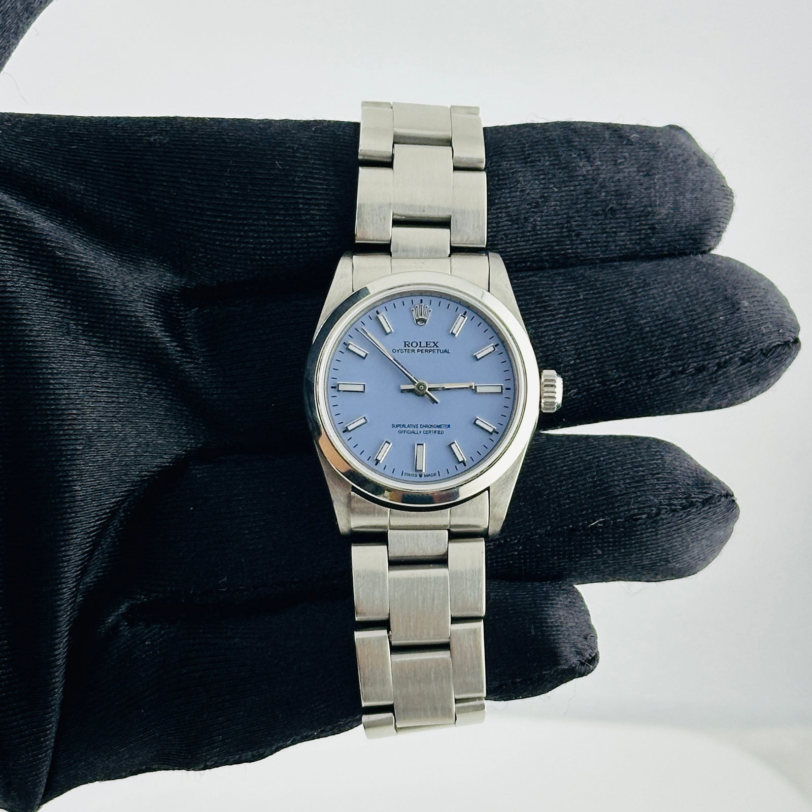Ladies Rolex Oyster Perpetual 67480 With Aftermarket Lavender Dial: Ladies Rolex Oyster Perpetual 67480 With Aftermarket Lavender Dial This ladies' Rolex Oyster Perpetual features an Aftermarket Lavender dial and a smooth bezel, paired with a classic Oyster bracelet. 