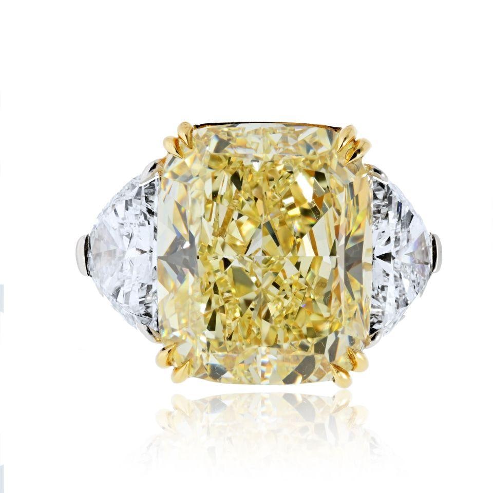 13.89 Carat Cushion Cut Fancy Yellow GIA Diamond Engagement Ring: 13.89 Carat Cushion Cut Fancy Yellow GIA Diamond Engagement Ring This exquisite engagement ring features a stunning 13.89 carat elongated fancy yellow cushion cut diamond at its center, graded VS2 for