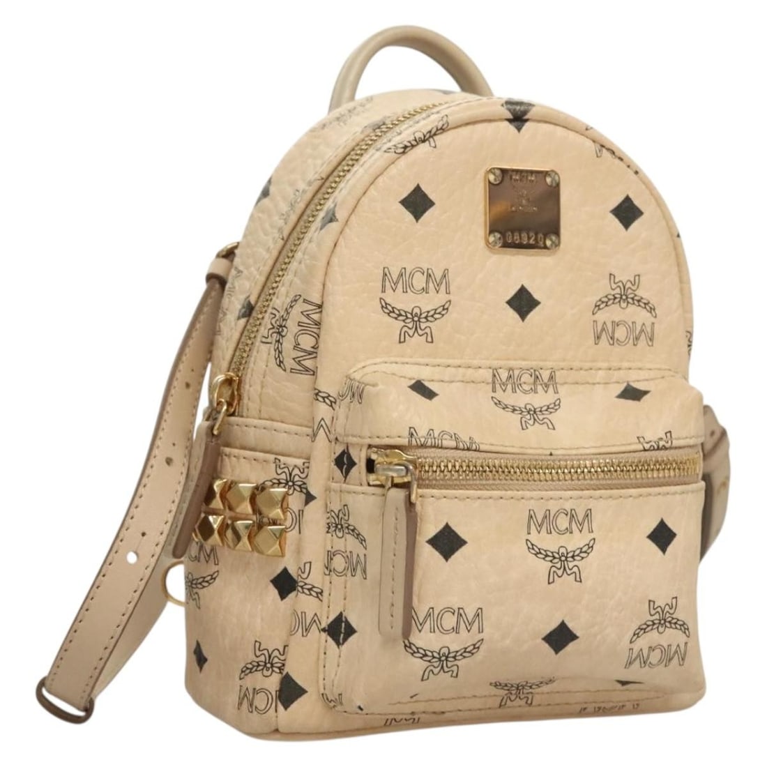 MCM Vicetos Logogram Beige PVC Leather Backpack Auth TH6195: MCM Vicetos Logogram Beige PVC Leather Backpack Auth TH6195 Introducing the MCM Vicetos Logogram Backpack, crafted from durable PVC leather in a stylish beige color. This backpack is designed for both