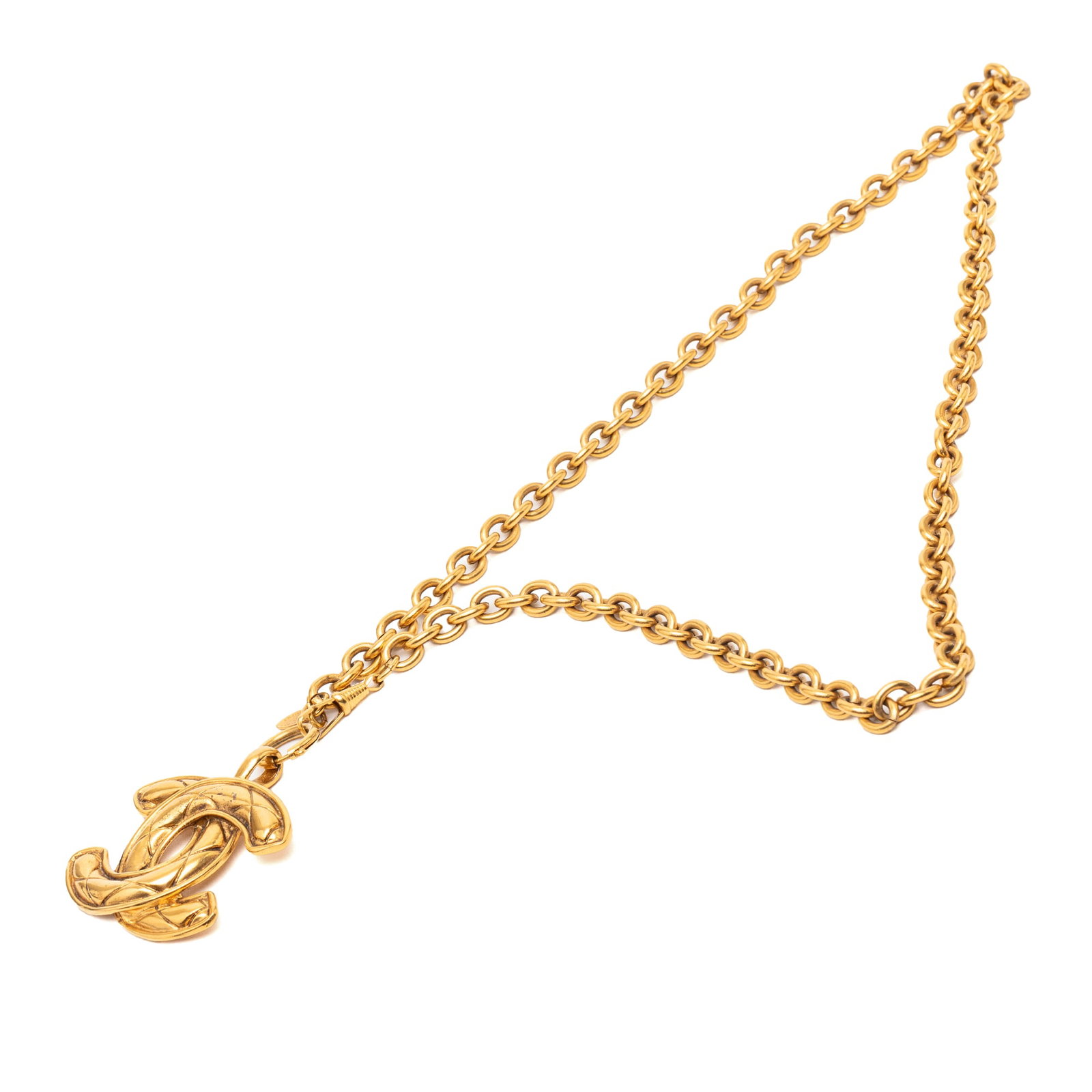 Chanel Quilted CC Logo Gold Plated Pendant Necklace: Chanel Quilted CC Logo Gold Plated Pendant Necklace This Chanel necklace features a gold-plated metal body with a signature quilted CC pendant and a spring ring closure. The necklace showcases the ico