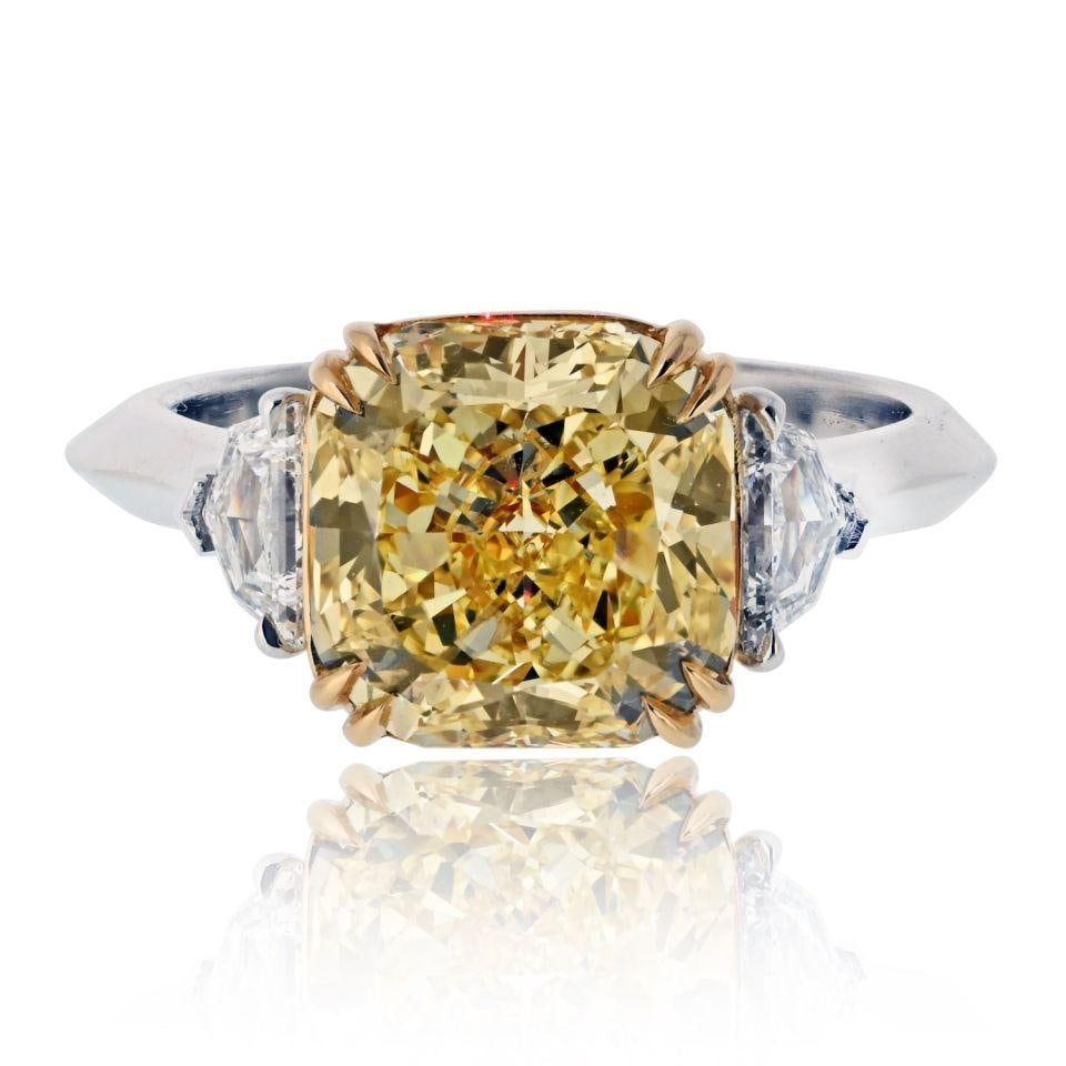 4.06 Carat GIA Radiant Cut Fancy Intense Yellow Diamond Engagement Ring: 4.06 Carat GIA Radiant Cut Fancy Intense Yellow Diamond Engagement Ring This stunning engagement ring features a captivating 4 carat Radiant Cut diamond in a Fancy Intense Yellow hue, graded VS1 clari