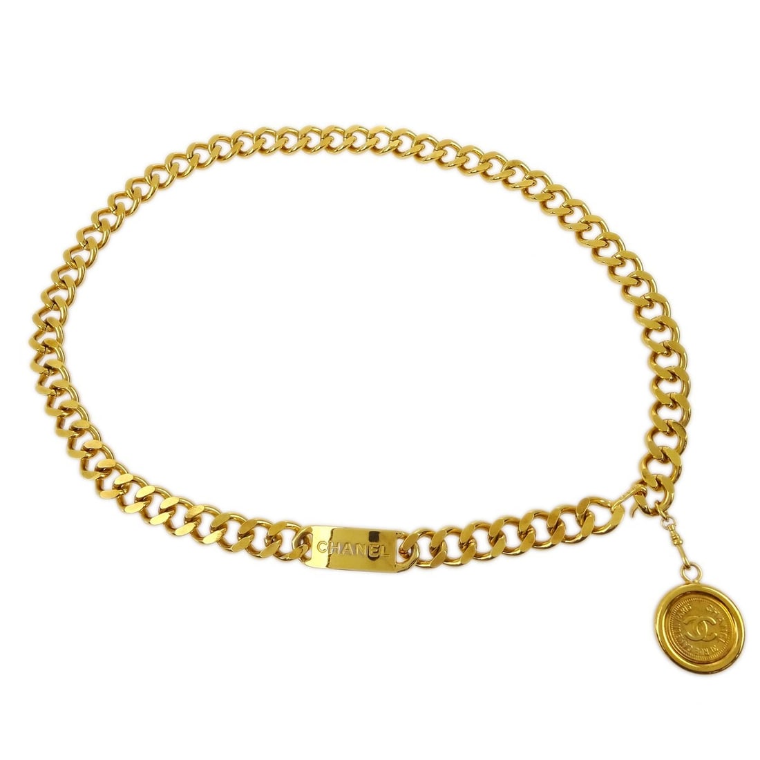 Chanel Gold-Plated Chain Belt with Medallion Accent 94A Small: Chanel Gold-Plated Chain Belt with Medallion Accent 94A Small This Chanel Medallion chain belt features a gold-plated finish and a classic chain design. Crafted in France, it is designed for women and