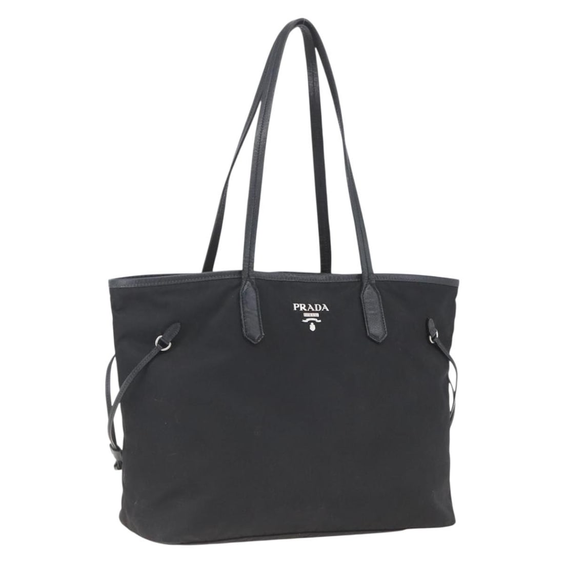 Black Nylon Tote Handbag by Prada with Silver Details: Black Nylon Tote Handbag by Prada with Silver Details This PRADA tote bag is crafted from black nylon with silver-tone accents. Designed for women, it features dual top handles and a spacious interior