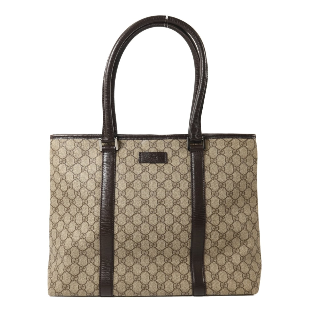 Gucci Brown Coated Canvas GG Tote Bag with Silver Hardware: Gucci Brown Coated Canvas GG Tote Bag with Silver Hardware This GUCCI tote bag features a brown PVC coated canvas exterior with silver-tone hardware. Designed for women, it offers ample space for dail