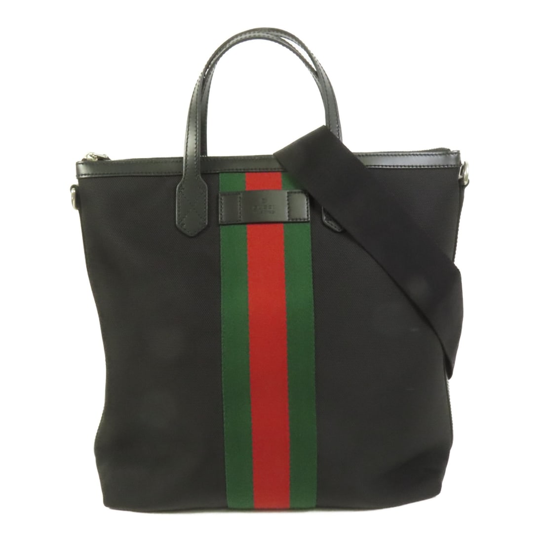 Gucci Black Canvas 2way Shoulder Tote Bag: Gucci Black Canvas 2way Shoulder Tote Bag This Gucci GG tote bag offers versatile carrying options with its 2-way design, allowing it to be used as both a tote and a shoulder bag. Crafted from durable