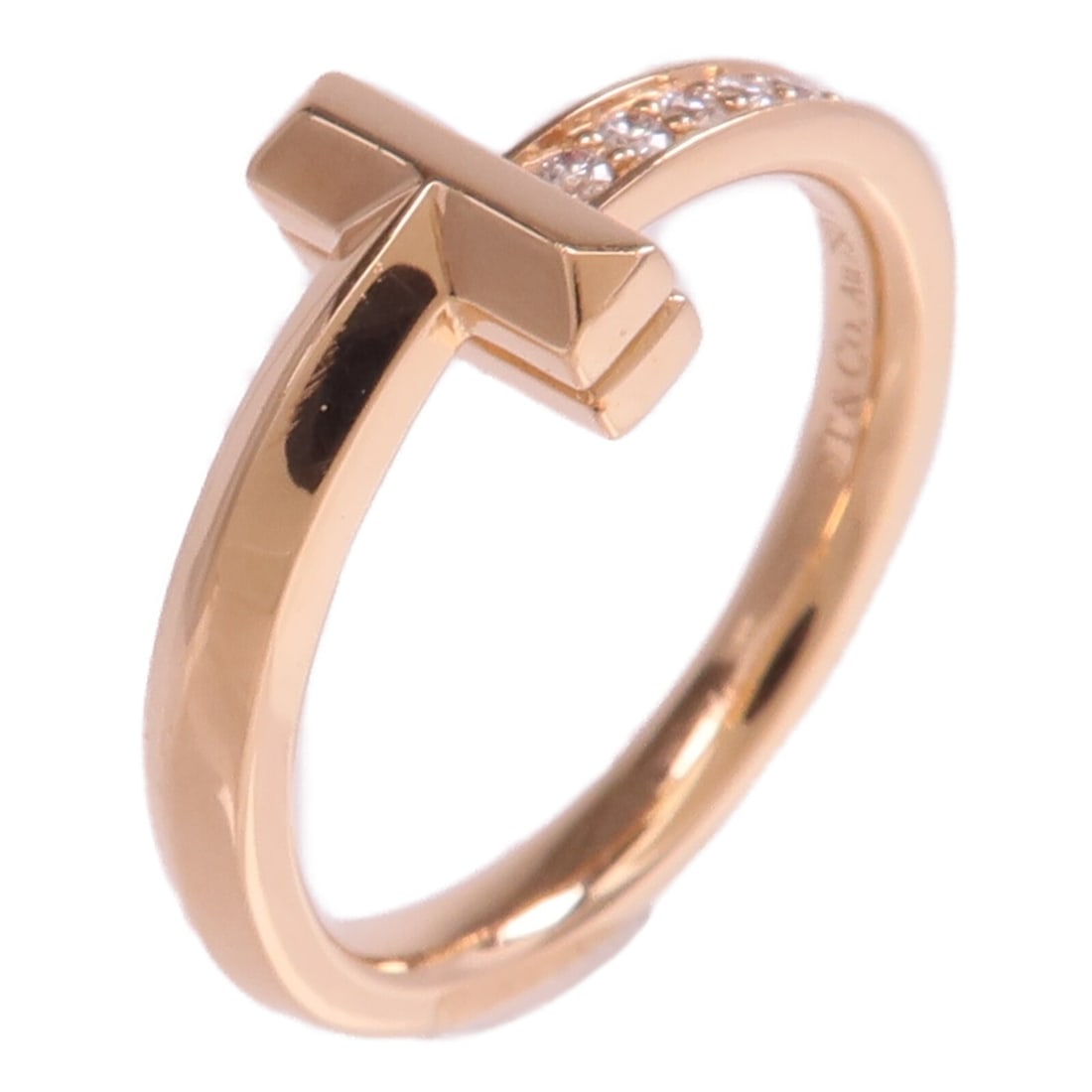Tiffany Co T1 Rose Gold Diamond Ring US 5: Tiffany Co T1 Rose Gold Diamond Ring US 5 This Tiffany & Co. T1 ring is crafted from 18K rose gold and features diamond accents. Designed for women, the ring is a US size 5 and showcases a refined, el