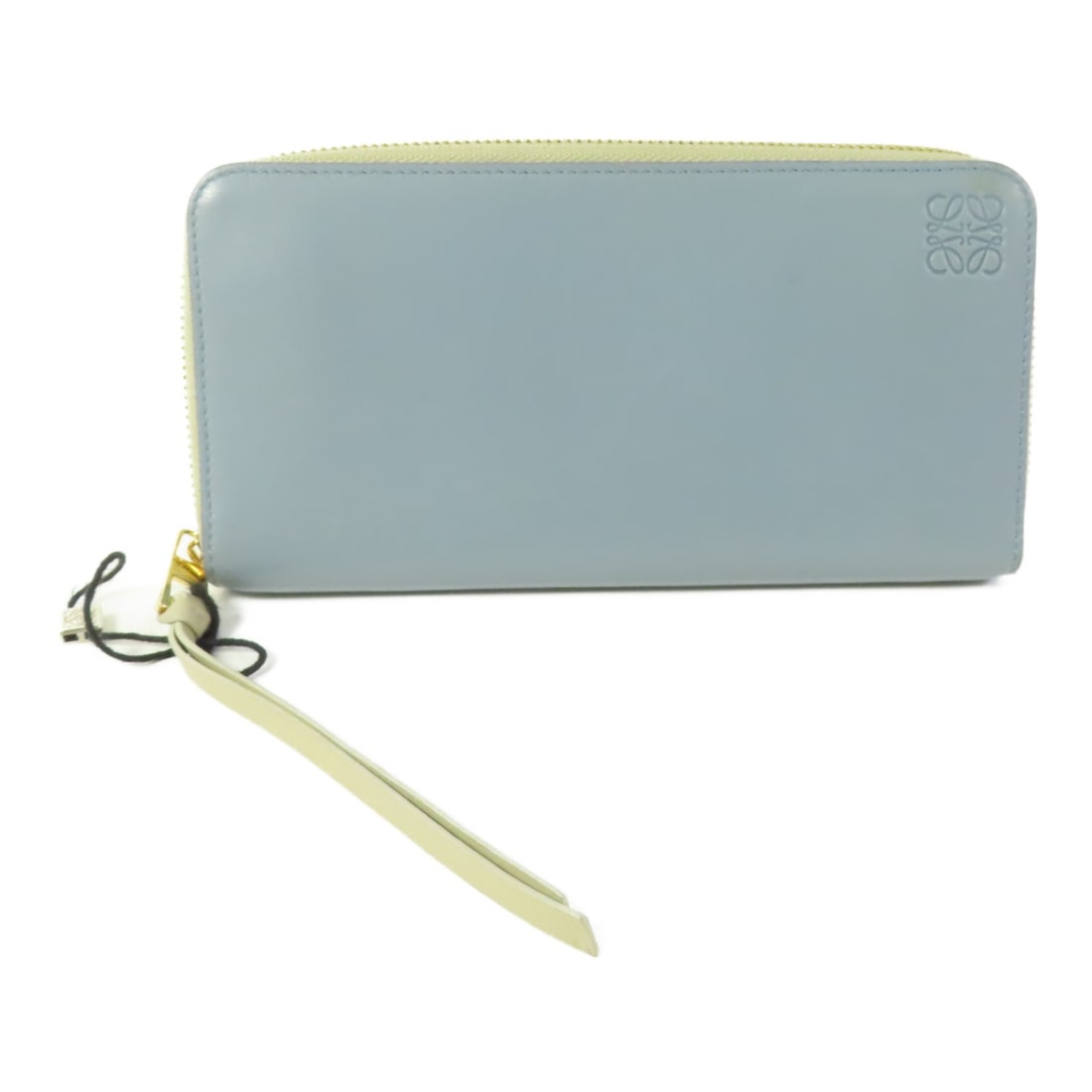 Sky Blue Lambskin Bifold Wallet Loewe Gold Hardware: Sky Blue Lambskin Bifold Wallet Loewe Gold Hardware This LOEWE bifold wallet is crafted from soft lambskin leather in a sky blue color. Featuring gold-tone hardware, it is designed for women and offer