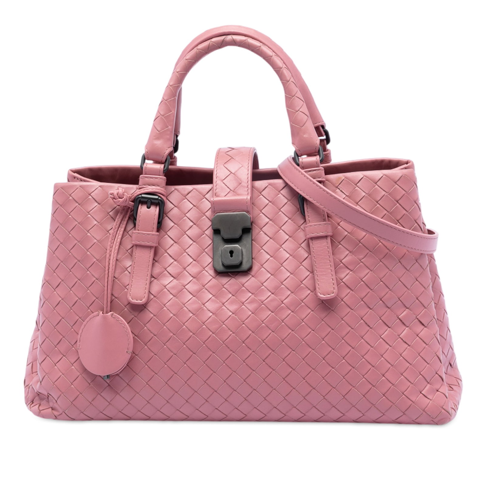 Small Pink Intrecciato Leather Roma Satchel by Bottega Veneta: Small Pink Intrecciato Leather Roma Satchel by Bottega Veneta This Bottega Veneta Small Nappa Intrecciato Roma Satchel features a woven nappa leather exterior in pink, rolled leather handles, and a de