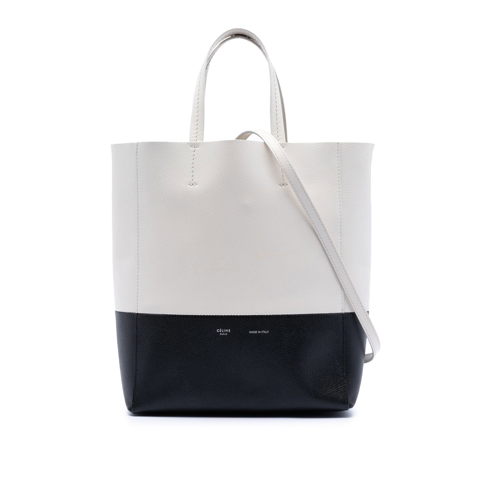 Small Vertical Cabas Leather Tote in White by Celine: Small Vertical Cabas Leather Tote in White by Celine This Celine Small Bicolor Grained Calfskin Vertical Cabas Tote features a leather body with flat leather handles, an open top, an adjustable flat l