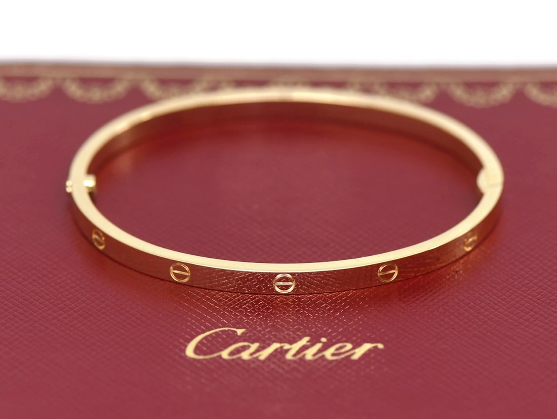 Cartier Love 18K Yellow Gold Bangle Bracelet Size 16: Cartier Love 18K Yellow Gold Bangle Bracelet Size 16 This Cartier Love Bracelet is crafted from 18K yellow gold and features the iconic bangle design in the small model with a width of 3.8mm. The brac