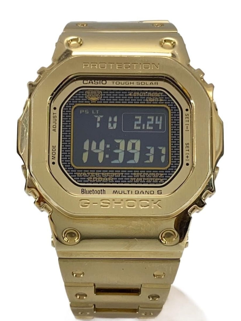 Casio G-Shock GMW-B5000GD-9JF Gold Men's Wristwatch: Casio G-Shock GMW-B5000GD-9JF Gold Men's Wristwatch This CASIO G-SHOCK GMW-B5000GD-9JF men's wristwatch features a gold-tone finish and is crafted in Japan. The watch is pre-owned and graded as Grade 