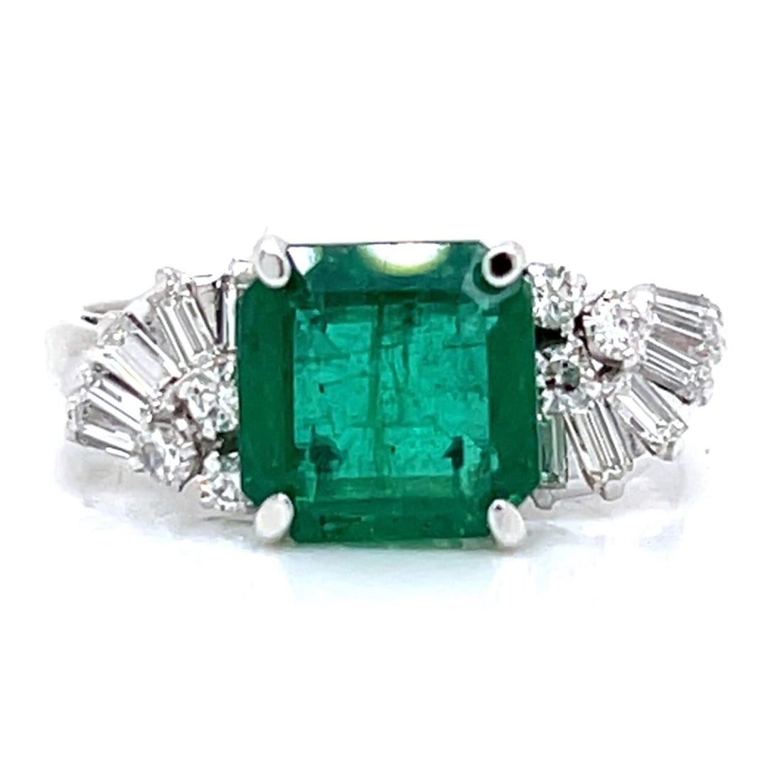 Vintage 1950's Platinum Emerald 2.67 Ct and 18 Diamond Ring: Vintage 1950's Platinum Emerald 2.67 Ct and 18 Diamond Ring This exquisite 1950's ring showcases a stunning 2.67 Ct. Emerald, beautifully complemented by 18 sparkling Diamonds totaling approximately 0
