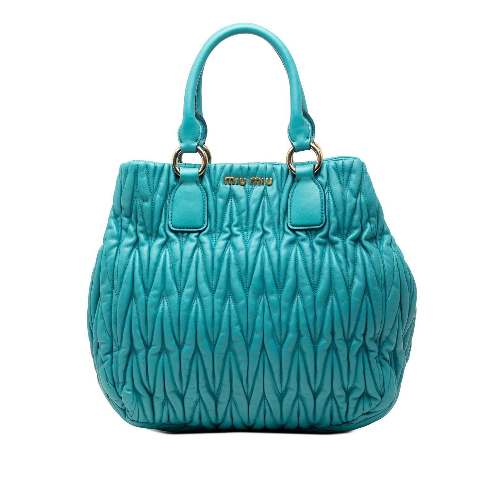 Blue Matelasse Quilted Nappa Leather Tote Bag by Miu Miu: Blue Matelasse Quilted Nappa Leather Tote Bag by Miu Miu This tote bag features a quilted nappa leather exterior with rolled leather handles and an open top secured by a magnetic snap closure. The int