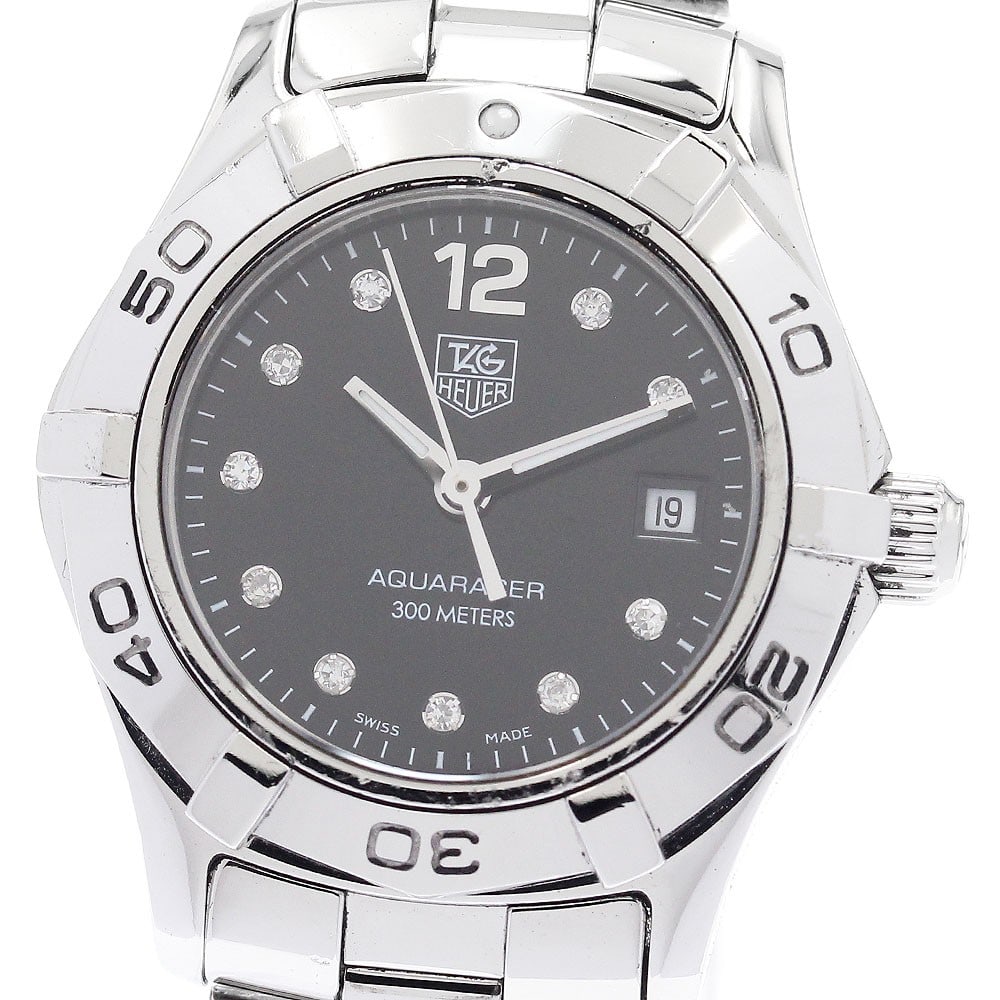 TAG Heuer Aquaracer WAF141C Quartz Date Women's Watch: TAG Heuer Aquaracer WAF141C Quartz Date Women's Watch This TAG Heuer Aquaracer WAF141C is a pre-owned women's wristwatch featuring a stainless steel case and bracelet. The watch has a black dial with 