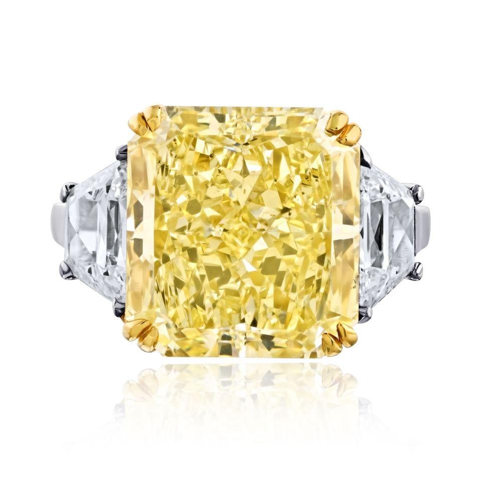 Radiant Cut 10.06ct Fancy Yellow Diamond Three Stone Ring Platinum 18K Gold GIA: Radiant Cut 10.06ct Fancy Yellow Diamond Three Stone Ring Platinum 18K Gold GIA This elegant three-stone engagement ring features a 10.06 carat GIA-certified fancy yellow radiant-cut diamond with SI1 