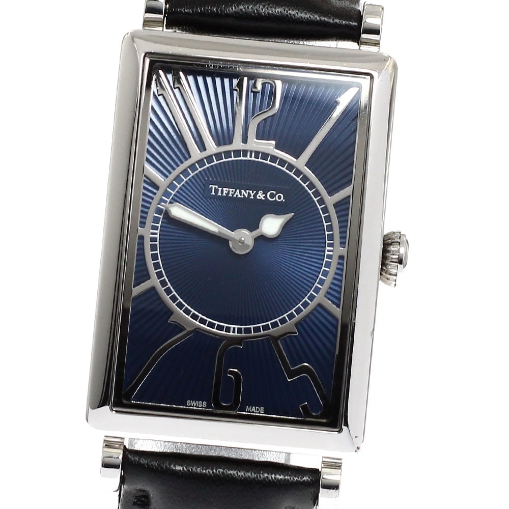 Tiffany Gallery quartz navy dial women's wristwatch: Tiffany Gallery quartz navy dial women's wristwatch This Tiffany & Co. Gallery women's wristwatch features a stainless steel case paired with a navy dial and a leather band. Powered by a quartz moveme