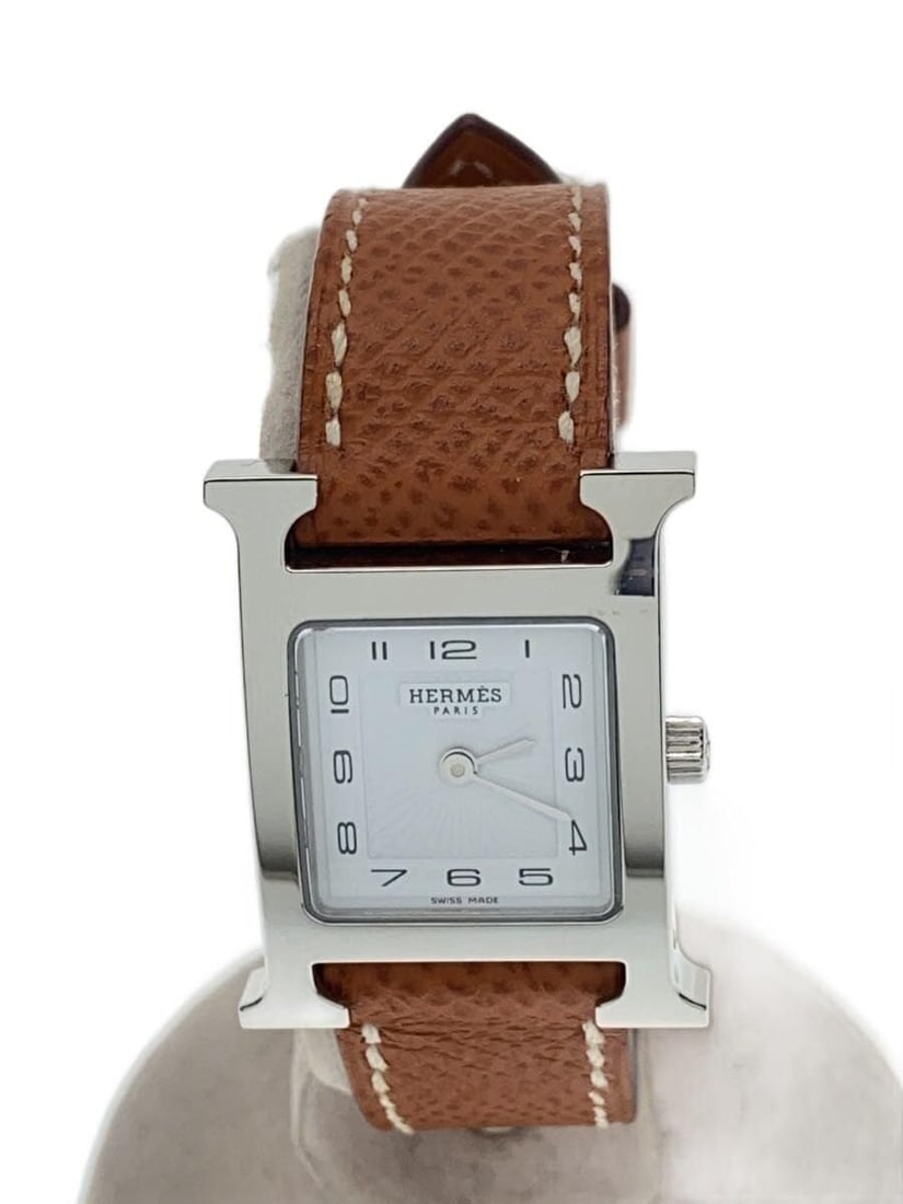 Hermes H Quartz Ladies Wristwatch Swiss Made: Hermes H Quartz Ladies Wristwatch Swiss Made This is a pre-owned HERMES H Watch designed for women, featuring a quartz movement. The watch is Swiss-made and shows slight signs of use, classified as B 
