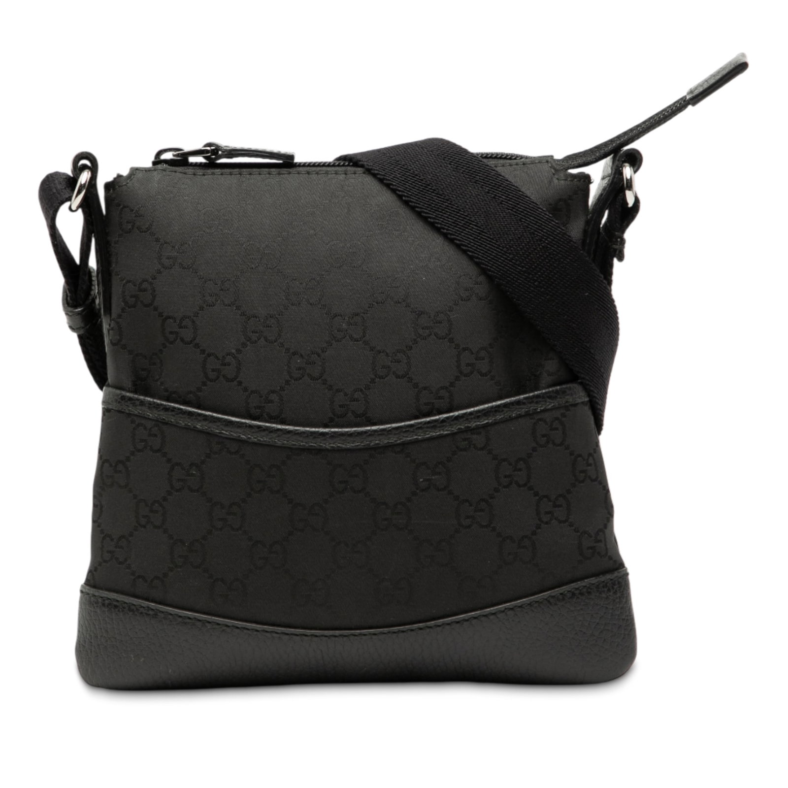 Black GG Nylon Adjustable Crossbody Bag by Gucci with Leather Trim: Black GG Nylon Adjustable Crossbody Bag by Gucci with Leather Trim This Gucci GG Nylon Crossbody bag features a black nylon body with leather trim, an adjustable flat strap, a top zip closure, an exte