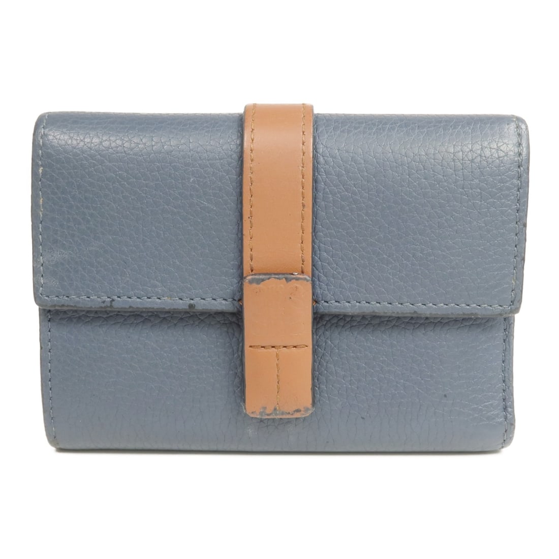 LOEWE Navy and Brown Calfskin Trifold Wallet with Silver Hardware: LOEWE Navy and Brown Calfskin Trifold Wallet with Silver Hardware This Loewe tri-fold wallet for women is crafted from high-quality calfskin leather in a navy color with brown accents. Designed for pr