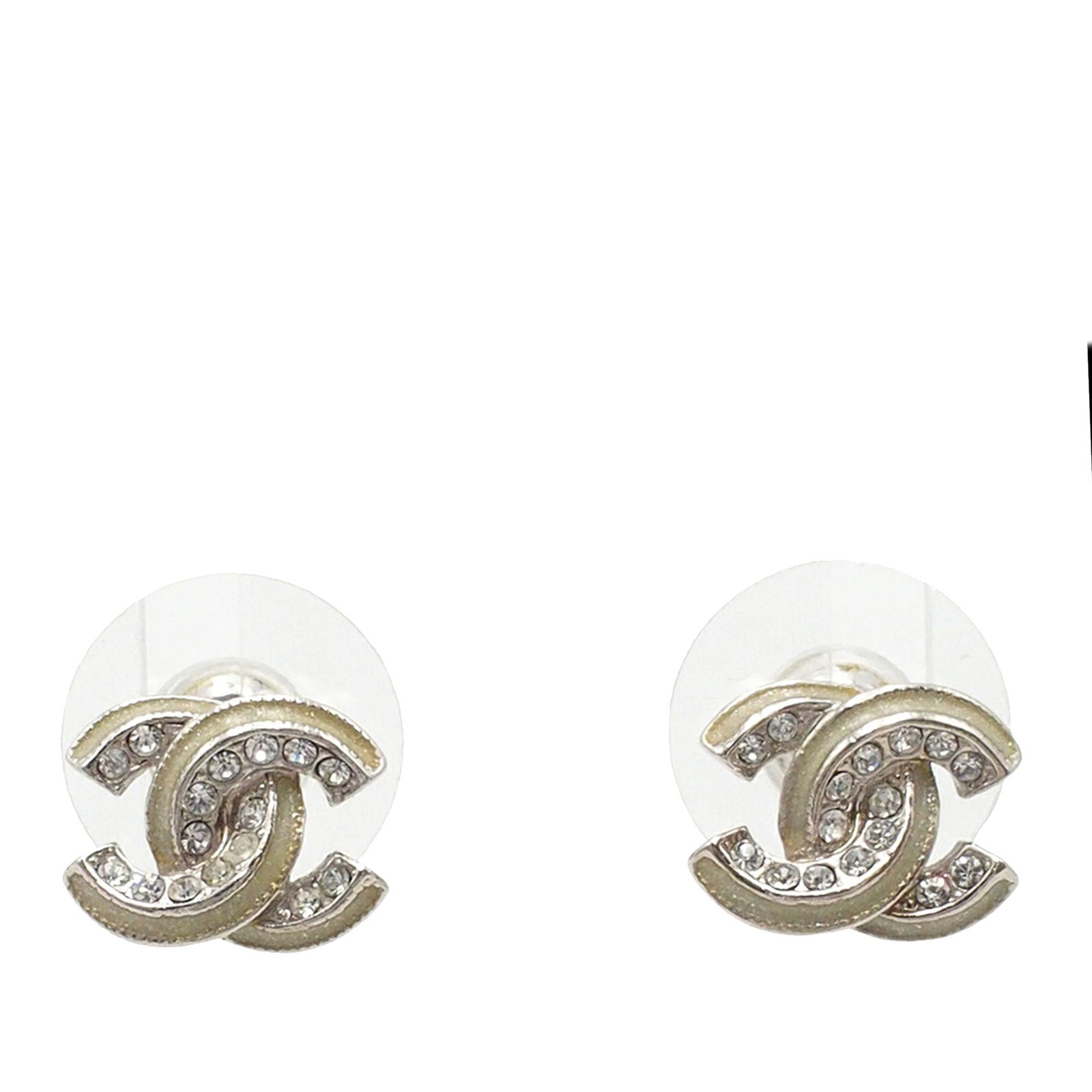 Chanel Crystal Embellished Brass Earrings with Push Back Closures: Chanel Crystal Embellished Brass Earrings with Push Back Closures These Chanel earrings feature a brass construction with crystal embellishments and secure push back closures. Designed in a silver col