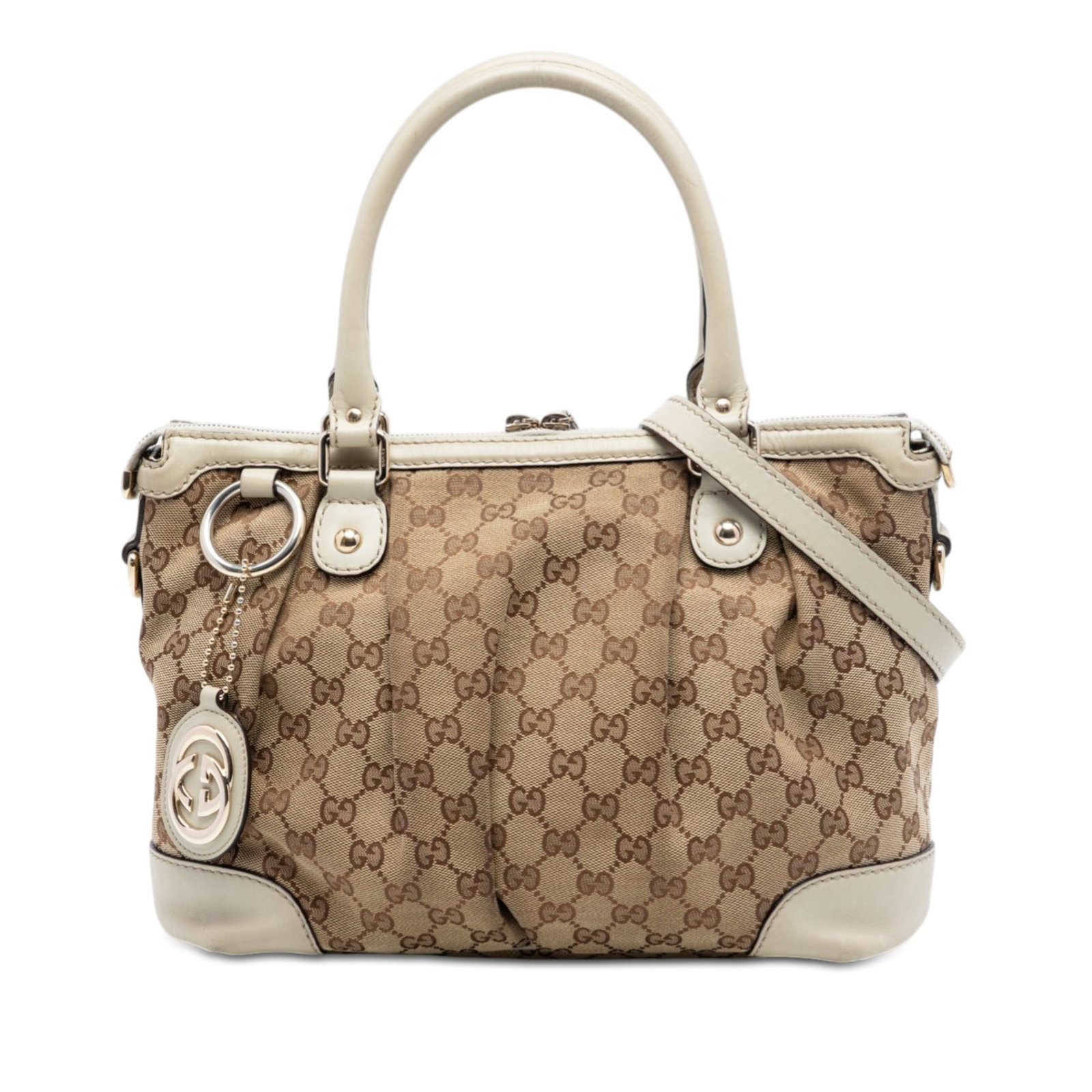 Gucci Sukey Beige Canvas Satchel with Leather Trim and Adjustable Strap: Gucci Sukey Beige Canvas Satchel with Leather Trim and Adjustable Strap The Gucci GG Canvas Sukey Satchel is crafted from beige canvas with leather trim and features rolled leather handles, a detachab