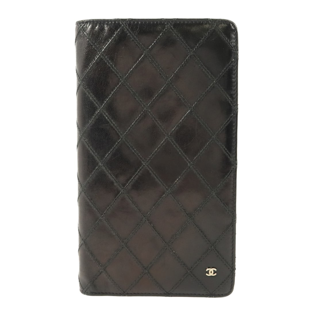 CHANEL Vintage Black Calfskin CC Long Bifold Wallet: CHANEL Vintage Black Calfskin CC Long Bifold Wallet This vintage CHANEL bifold long wallet is crafted from black calfskin leather, offering a classic and elegant accessory for women. The wallet featur