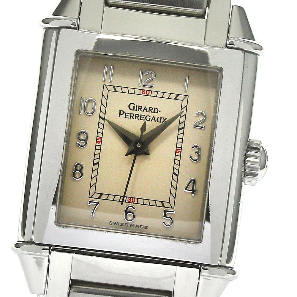 Girard Perregaux 2590 Women's Manual Wind Steel Wristwatch: Girard Perregaux 2590 Women's Manual Wind Steel Wristwatch This vintage Girard Perregaux 2590 women's wristwatch features a stainless steel case and band with a beige dial. The watch is powered by a m