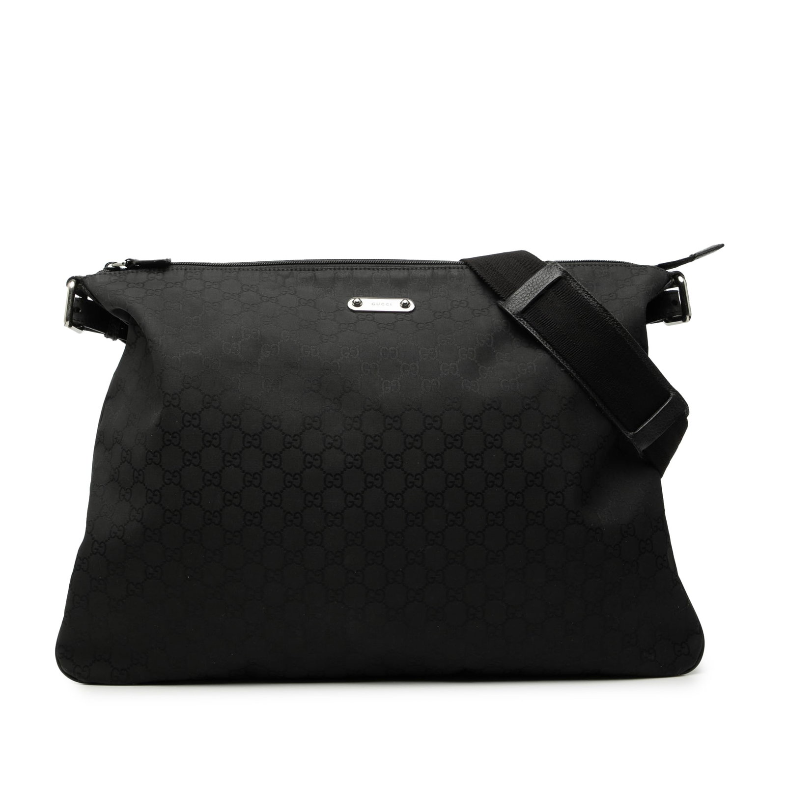 Black GG Nylon Crossbody Bag with Adjustable Strap by Gucci: Black GG Nylon Crossbody Bag with Adjustable Strap by Gucci This Gucci GG Nylon Crossbody bag features a black nylon body with an adjustable flat strap, a top zip closure, and an interior zip pocket. 