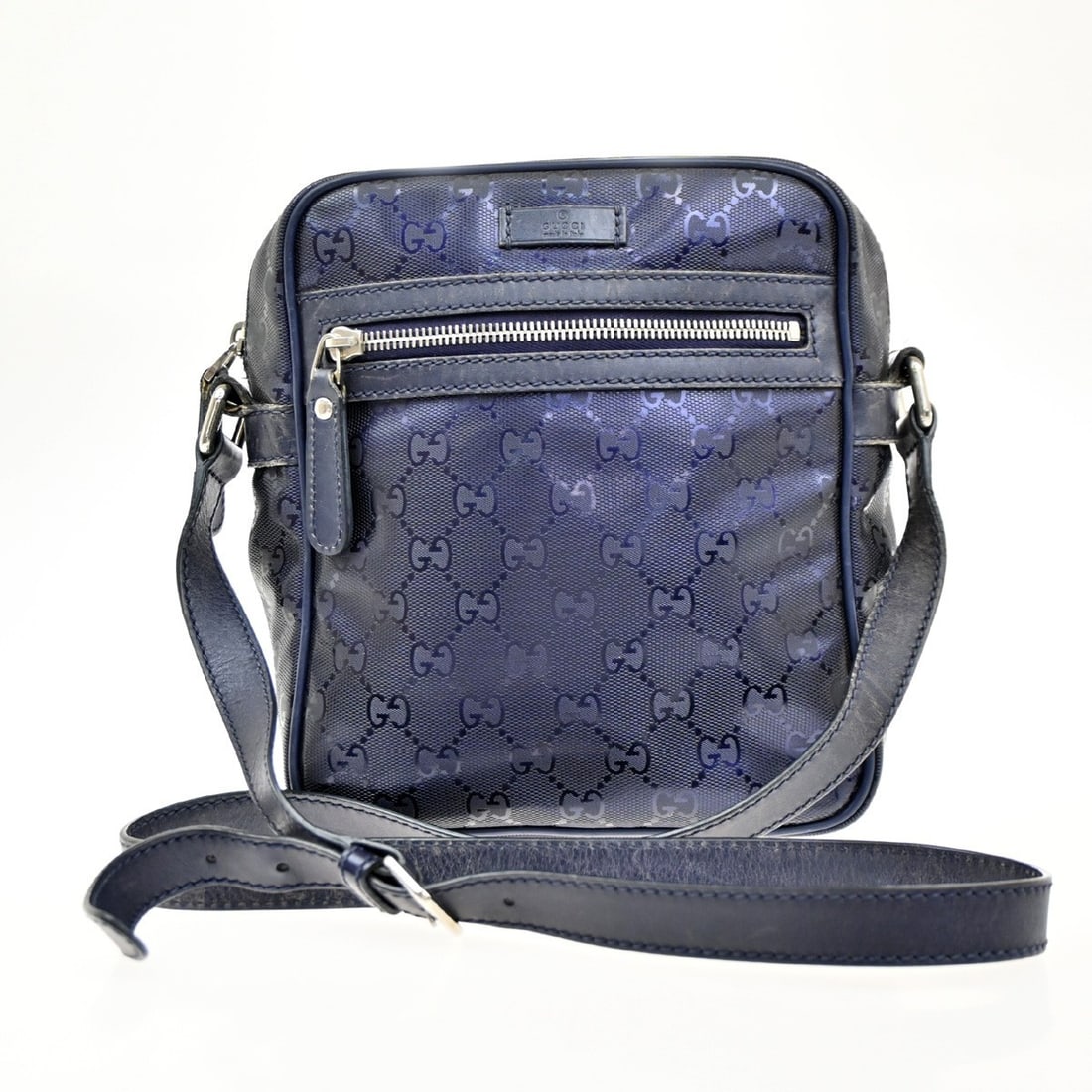 Navy PVC Gucci Zip Crossbody Shoulder Bag 19cm by 20cm: Navy PVC Gucci Zip Crossbody Shoulder Bag 19cm by 20cm This Gucci Zip Crossbody Bag features the GG Imprime design in navy PVC. Crafted in Italy, it is designed for female use and offers a compact sil
