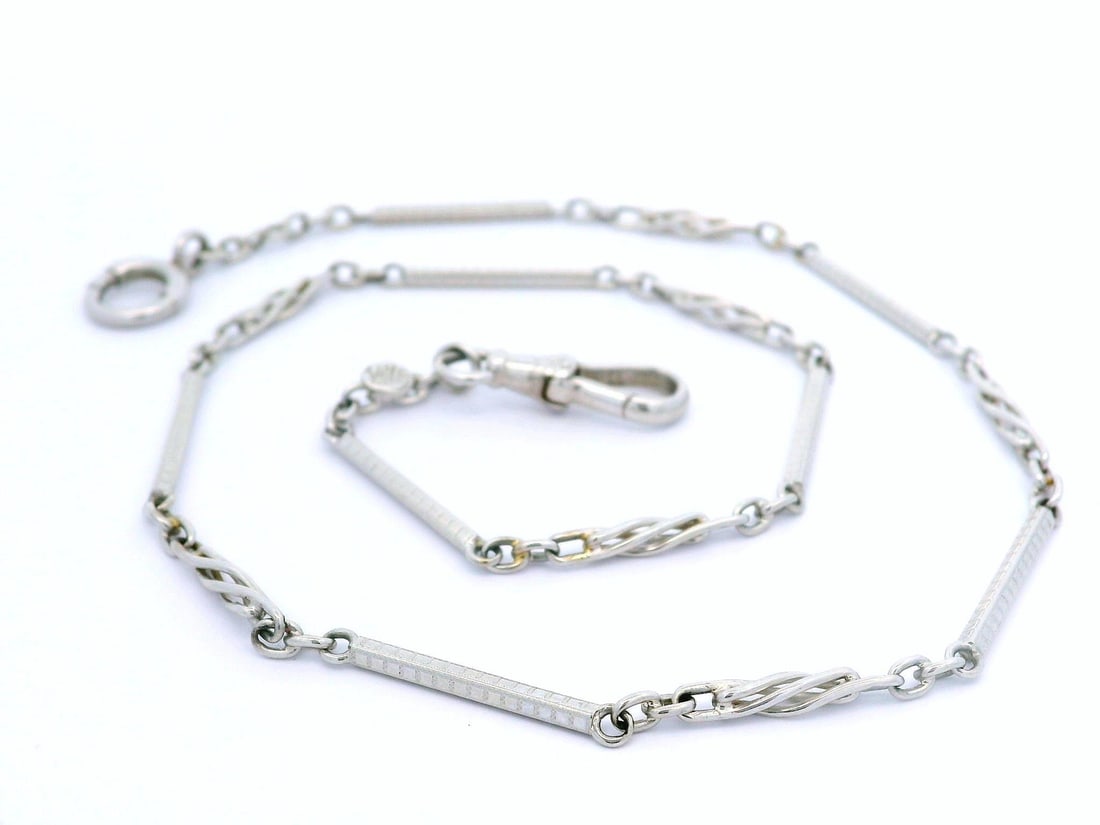 Vintage 14k White Gold Etched Pocket Watch Chain Spring Ring Clasp: Vintage 14k White Gold Etched Pocket Watch Chain Spring Ring Clasp This vintage pocket watch chain is crafted from 14k white gold, showcasing an elegant etched rectangular link design. Measuring 14.5 