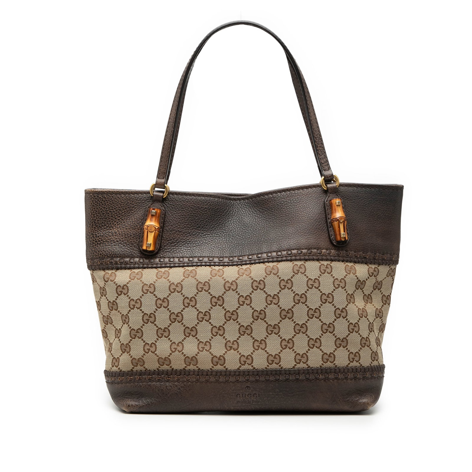 Gucci Crafty Tote Bag GG Canvas with Leather Trim: Gucci Crafty Tote Bag GG Canvas with Leather Trim The Gucci GG Canvas Laidback Crafty Tote features a beige canvas body with leather trim and flat leather straps. It is designed with an open top secur