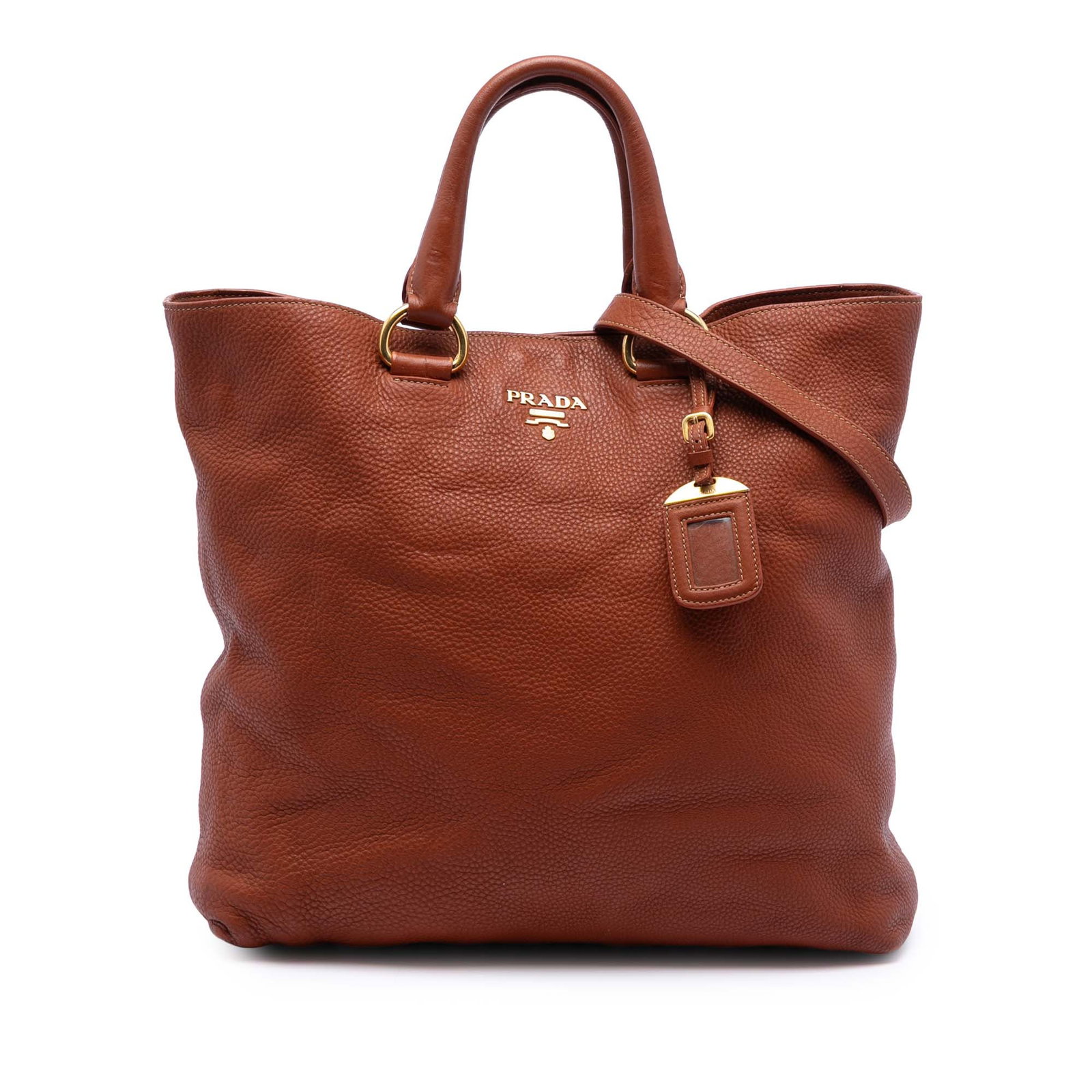 Prada Vitello Daino Brown Leather Convertible Satchel with Detachable Strap: Prada Vitello Daino Brown Leather Convertible Satchel with Detachable Strap This Prada Vitello Daino Open Convertible Tote is crafted from brown leather and features rolled leather handles, a detachab