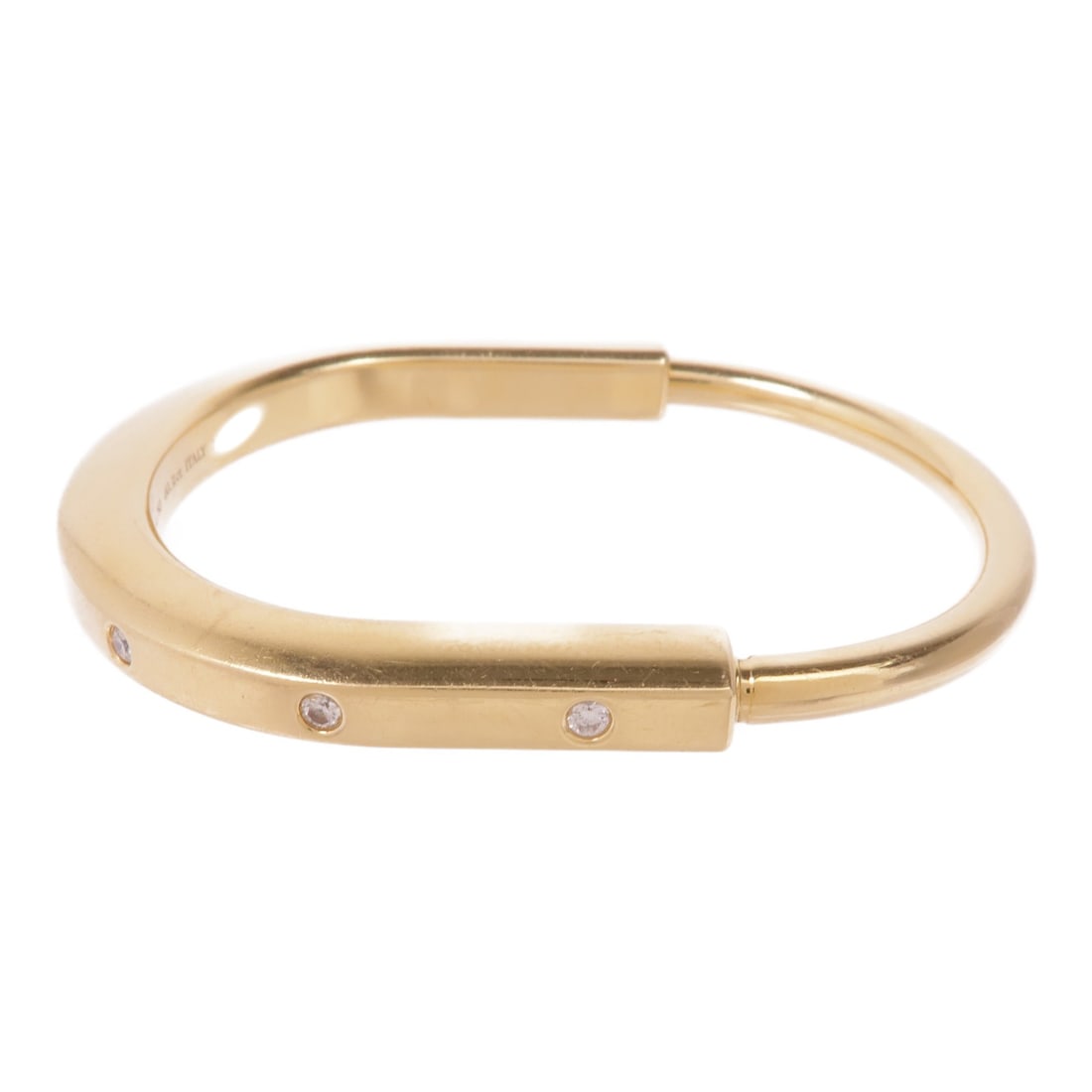 TIFFANY&CO 18K Yellow Gold Diamond Bangle Bracelet: TIFFANY&CO 18K Yellow Gold Diamond Bangle Bracelet This stunning Tiffany & Co. bangle bracelet showcases a luxurious design crafted from 18K yellow gold. Adorned with clear diamonds, this piece embodi