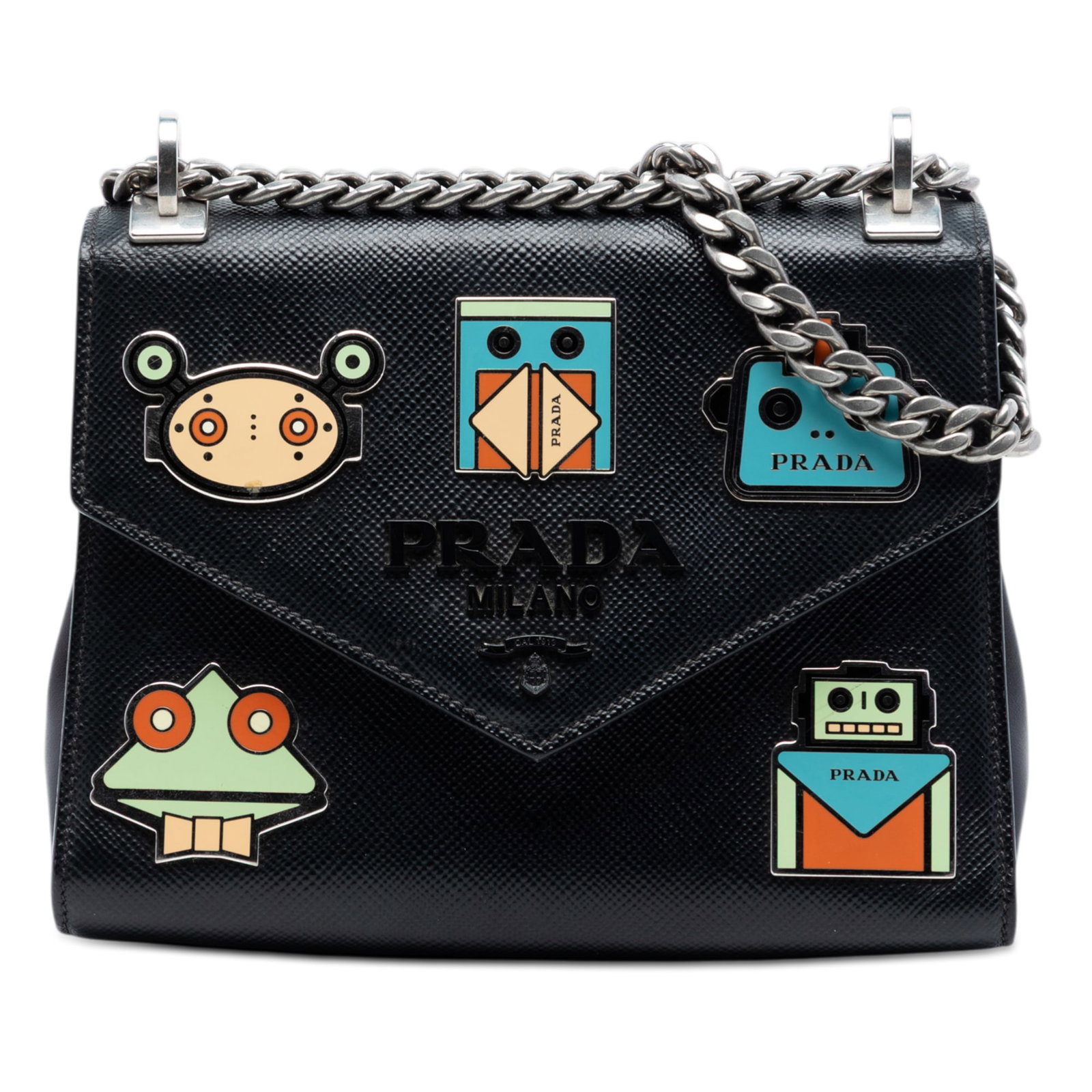 Prada Saffiano Cuir Black Robot Applique Leather Envelope Crossbody Bag: Prada Saffiano Cuir Black Robot Applique Leather Envelope Crossbody Bag This Prada Saffiano Cuir Monochrome Robot Patches Envelope Chain Flap is a crossbody bag crafted from saffiano leather and featu