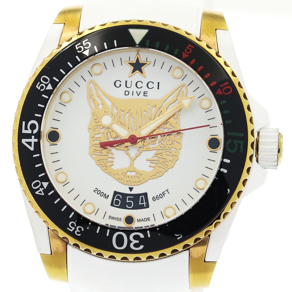 Gucci Dive YA136322 quartz date wristwatch: Gucci Dive YA136322 quartz date wristwatch This pre-owned Gucci Dive Date Mystic Cat wristwatch features a durable stainless steel, gold-plated, and rubber case, paired with a rubber band. The watch h