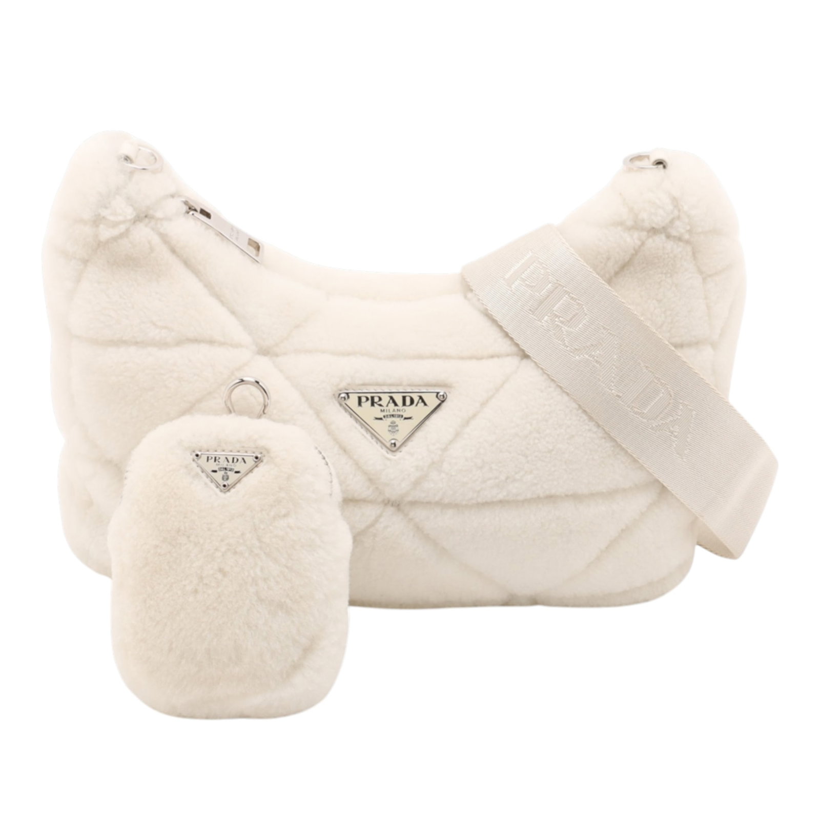 Prada Re Edition 2005 White Quilted Shearling Crossbody Bag with Zip Pouch: Prada Re Edition 2005 White Quilted Shearling Crossbody Bag with Zip Pouch This Prada crossbody bag features a quilted shearling body in white, complemented by an adjustable flat strap. It is designed