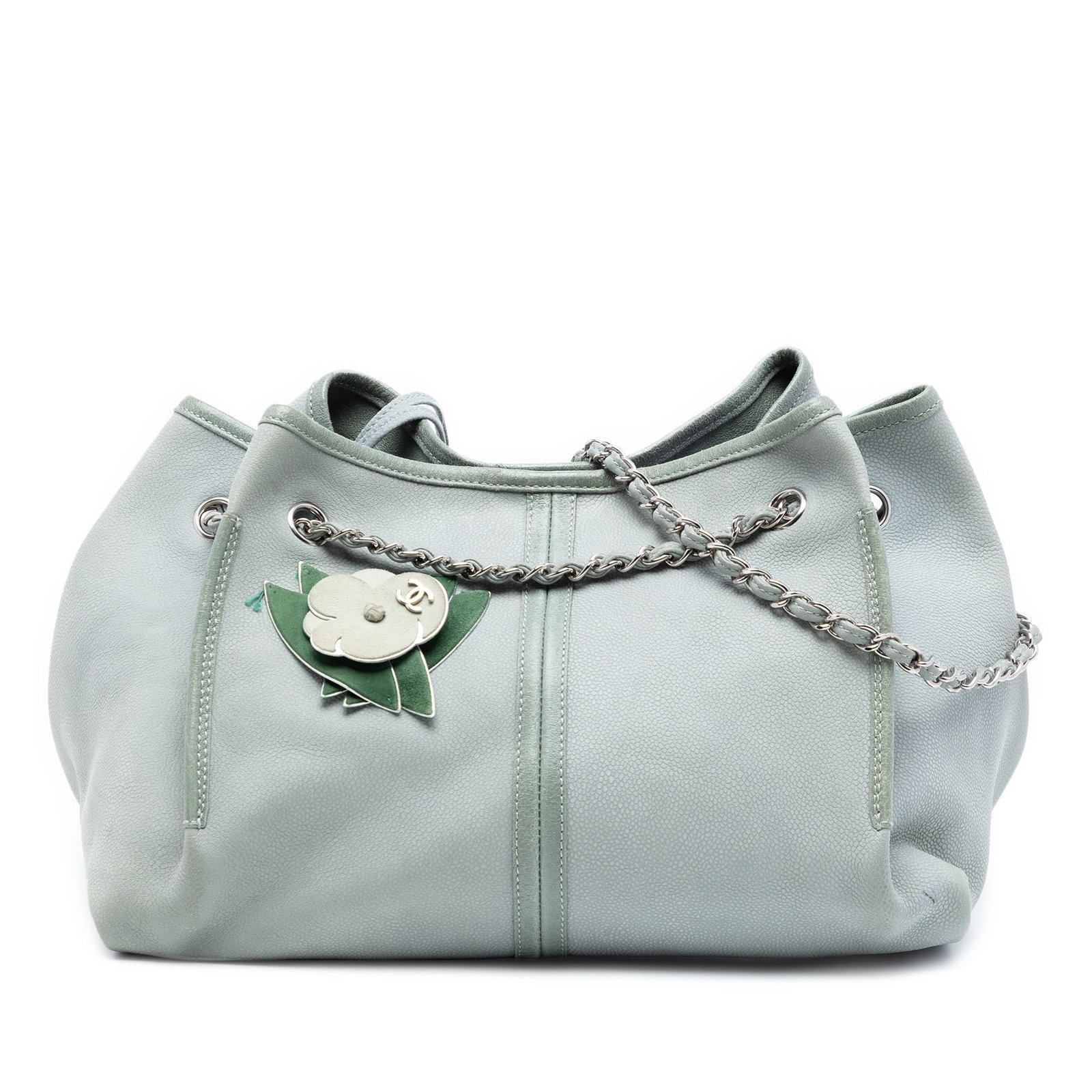 Chanel Camellia Patch Grained Nubuck Leather Green Tote Bag: Chanel Camellia Patch Grained Nubuck Leather Green Tote Bag This Chanel Grained Nubuck Camellia Patch Shopping Tote features a leather body with camellia patch accents and leather-woven chain straps. 