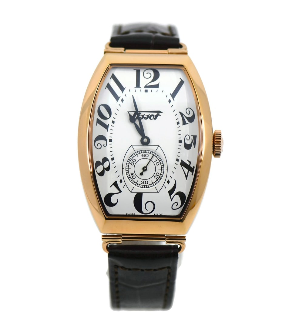 Tissot Heritage Manual Wind Leather Strap Wristwatch: Tissot Heritage Manual Wind Leather Strap Wristwatch This Tissot Heritage wristwatch features a stainless steel case and a mechanical manual movement. Designed for men, it comes with a leather band an
