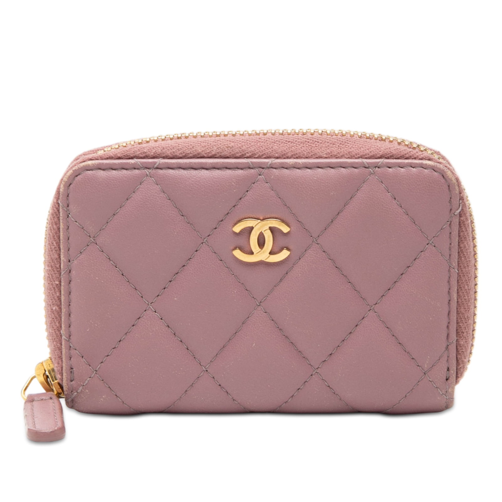 Chanel Pink Quilted Lambskin Leather Zip Coin Purse with CC Logo: Chanel Pink Quilted Lambskin Leather Zip Coin Purse with CC Logo This Chanel CC Quilted Lambskin Coin Pouch features a pink quilted lambskin leather exterior with a zip-around closure and interior sli