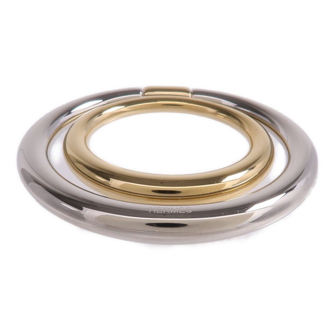 Hermes Twins silver tone scarf ring: Hermes Twins silver tone scarf ring This Hermes scarf ring features a stylish design in silver and gold tones, crafted from metal. Designed for women, it offers a sophisticated way to accessorize scar