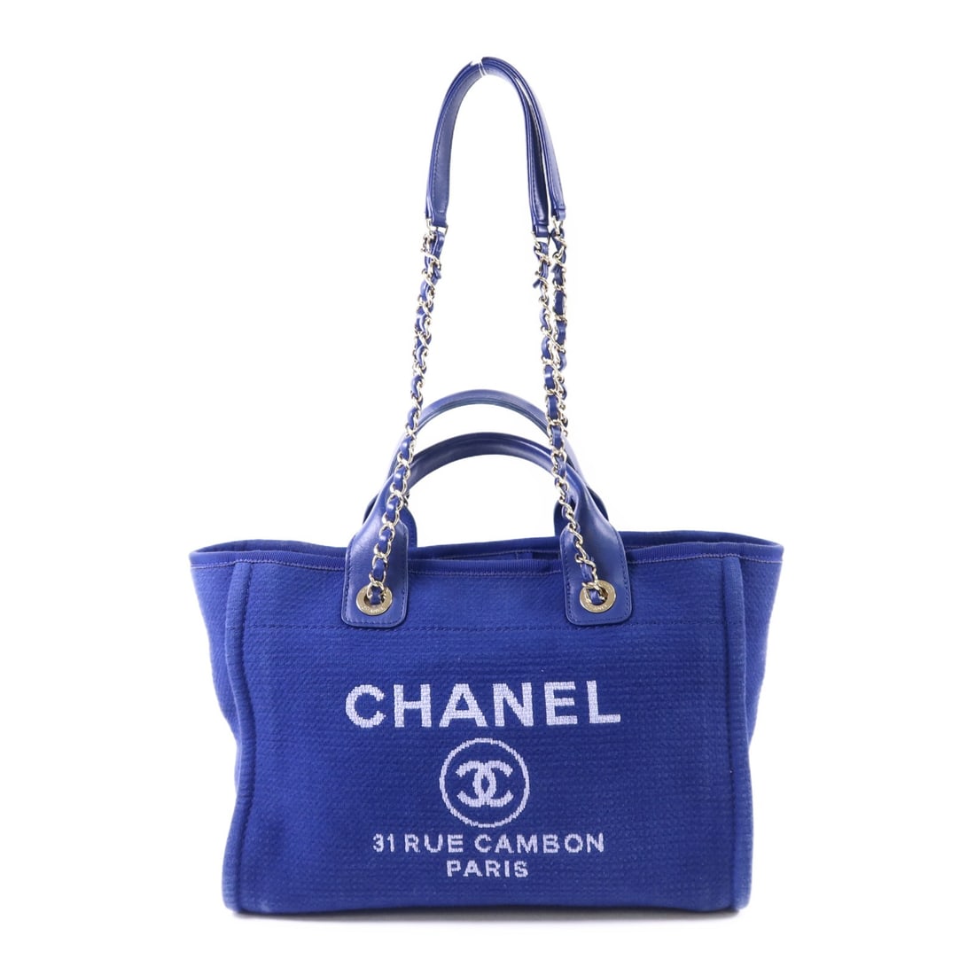 CHANEL Deauville Blue Canvas Tote Bag with Gold Hardware and Pouch: CHANEL Deauville Blue Canvas Tote Bag with Gold Hardware and Pouch This CHANEL Deauville Tote offers versatile 2-way carrying as both a shoulder bag and tote. Crafted from blue canvas, it features gol